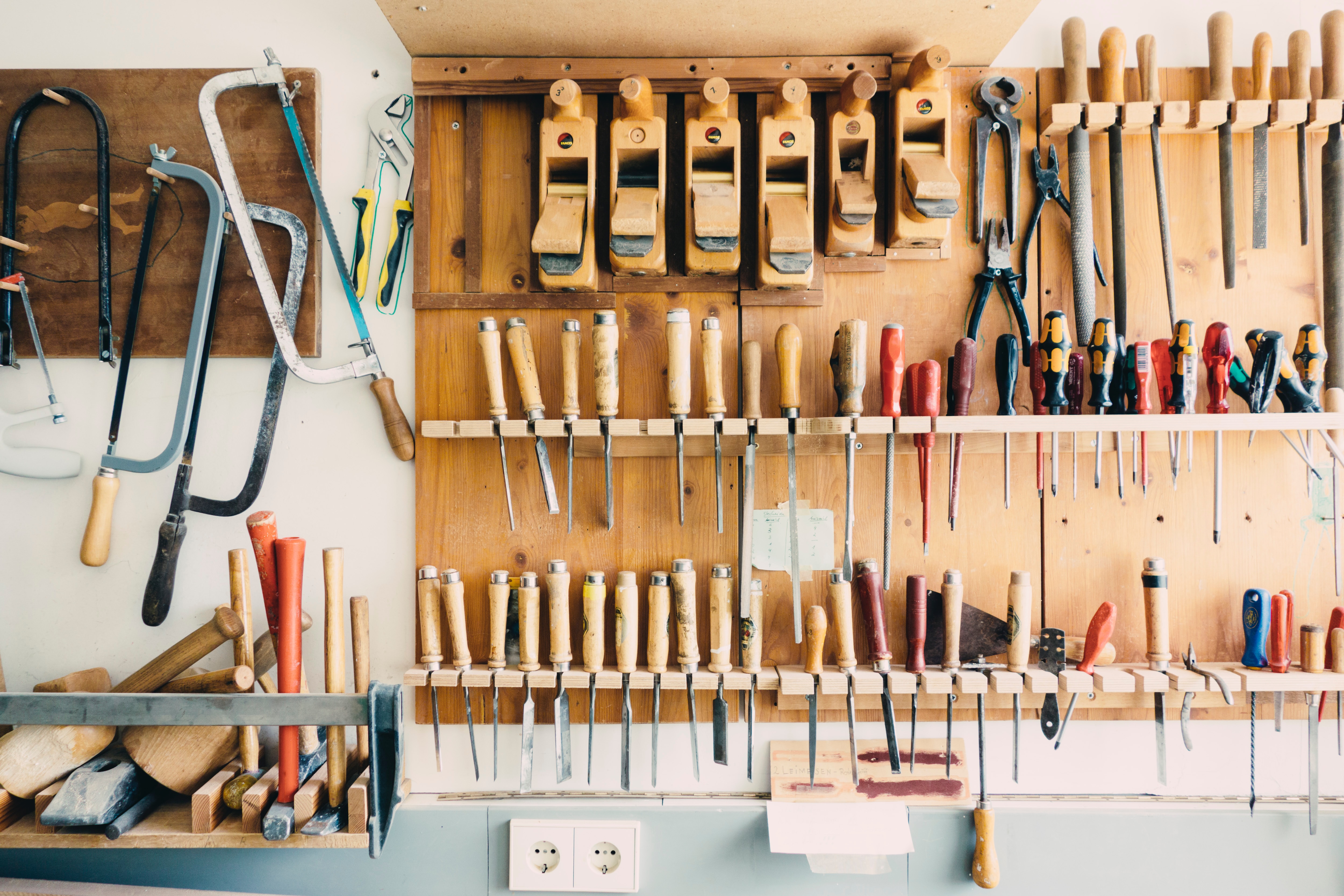 tools hanging up in the garden shed